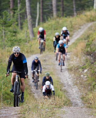 A group of men compete in the 2024 TransRockies Gravel Royale bike race in British Columbia, Canada. The Gravel Royale is a three-day stage race based out of Nipika Mountain Resort near Radium, British Columbia, Canada. The course takes the racers over a combination of gravel forestry and mining roads. (John Gibson Photo / GibsonPictures)